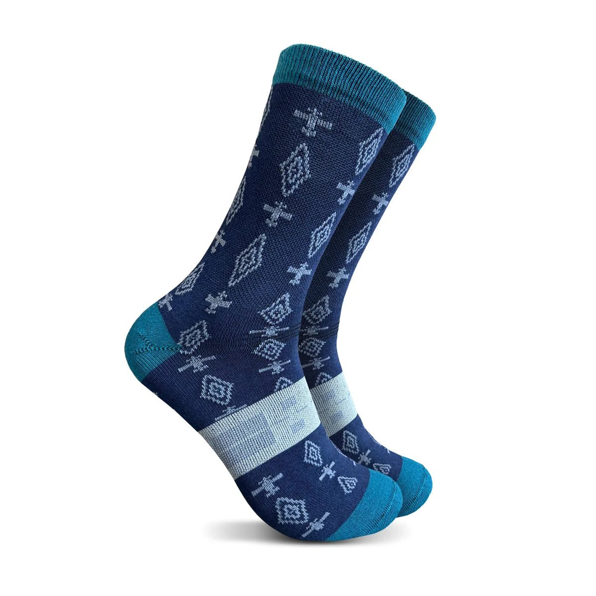A pair of crew socks with a navy blue base, decorated with a repeating pattern of white geometric diamond and plane motifs, accented with teal toes, heels, and cuffs, and a light gray knit band at the instep.